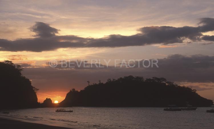 Sunset;colorful;sky;el ocdtal costa rio;cloudsl sun;yellow;water;boat;sillouettes;anchorages;ocean